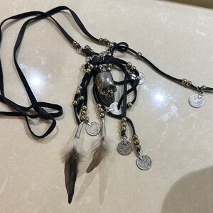 Leather skull necklace with coins, beads and feathers